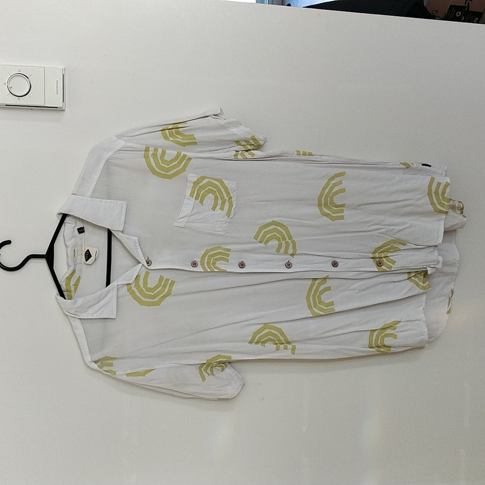 Large short sleeves shirt from TCSS.  Yellow patterns .  Very soft. Wood buttons